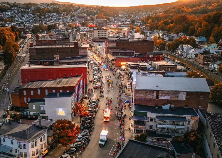 Aerial view of a parade in a small town