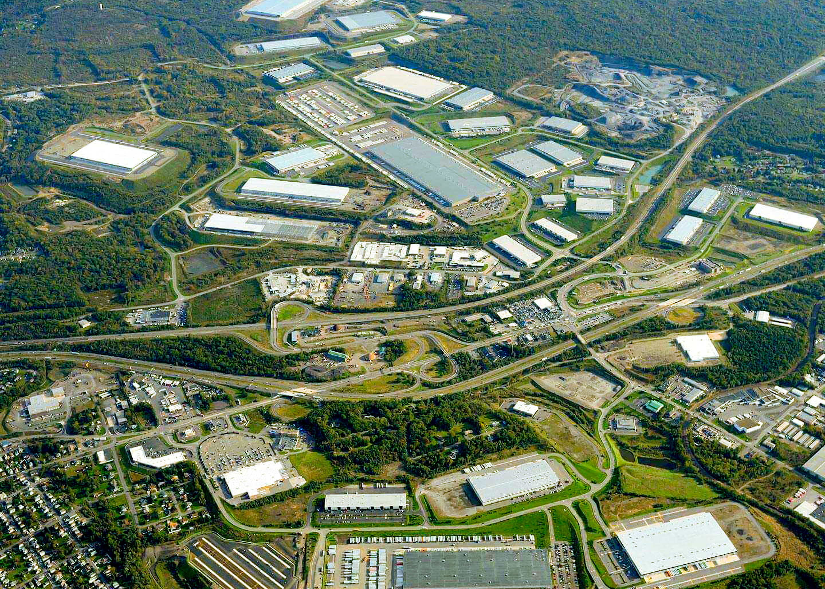 Aerial view of industrial park with warehouses and roads