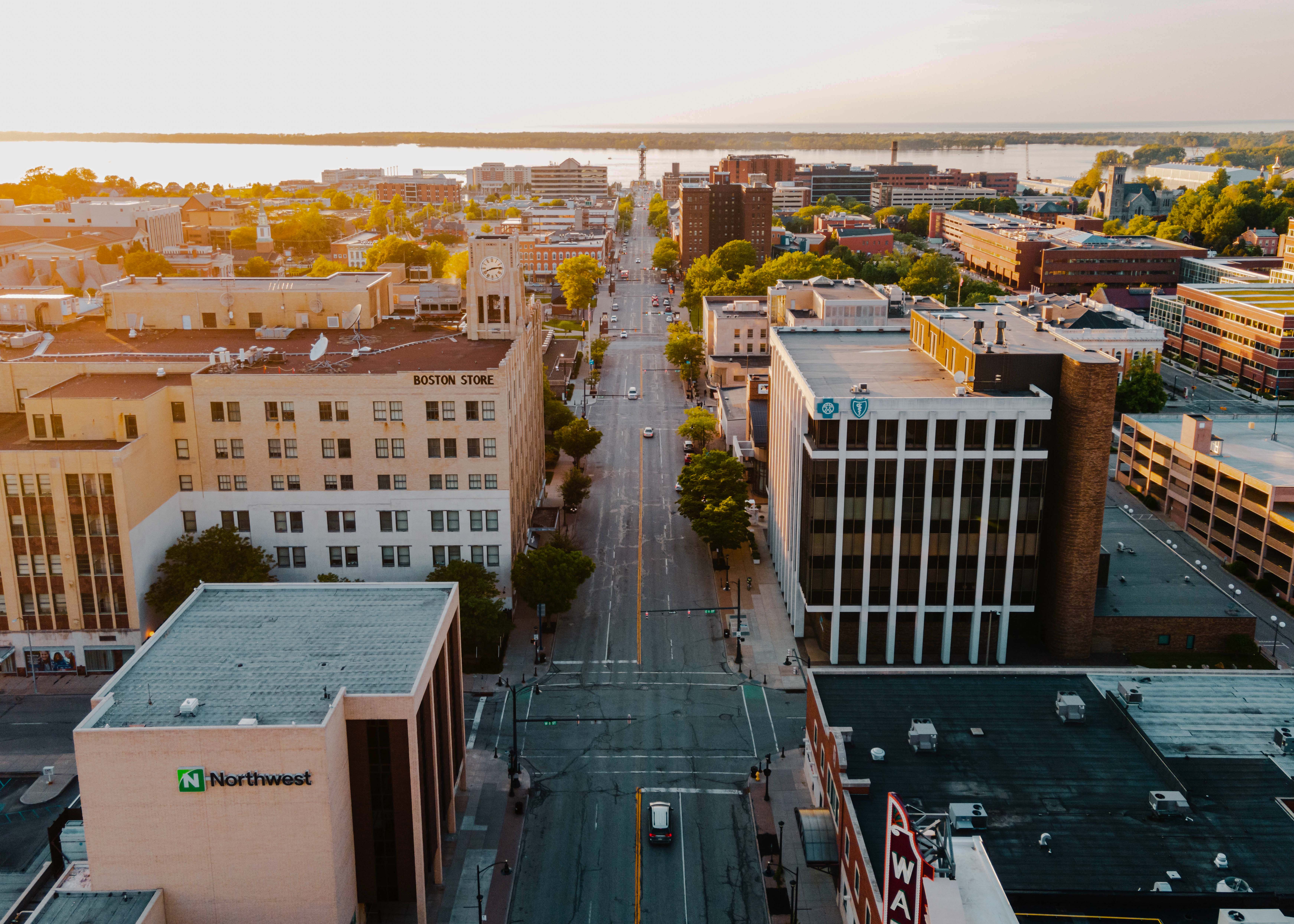 Aerial view of mid-rise buildings in downtown Erie, Pennsylvania, during sunset.