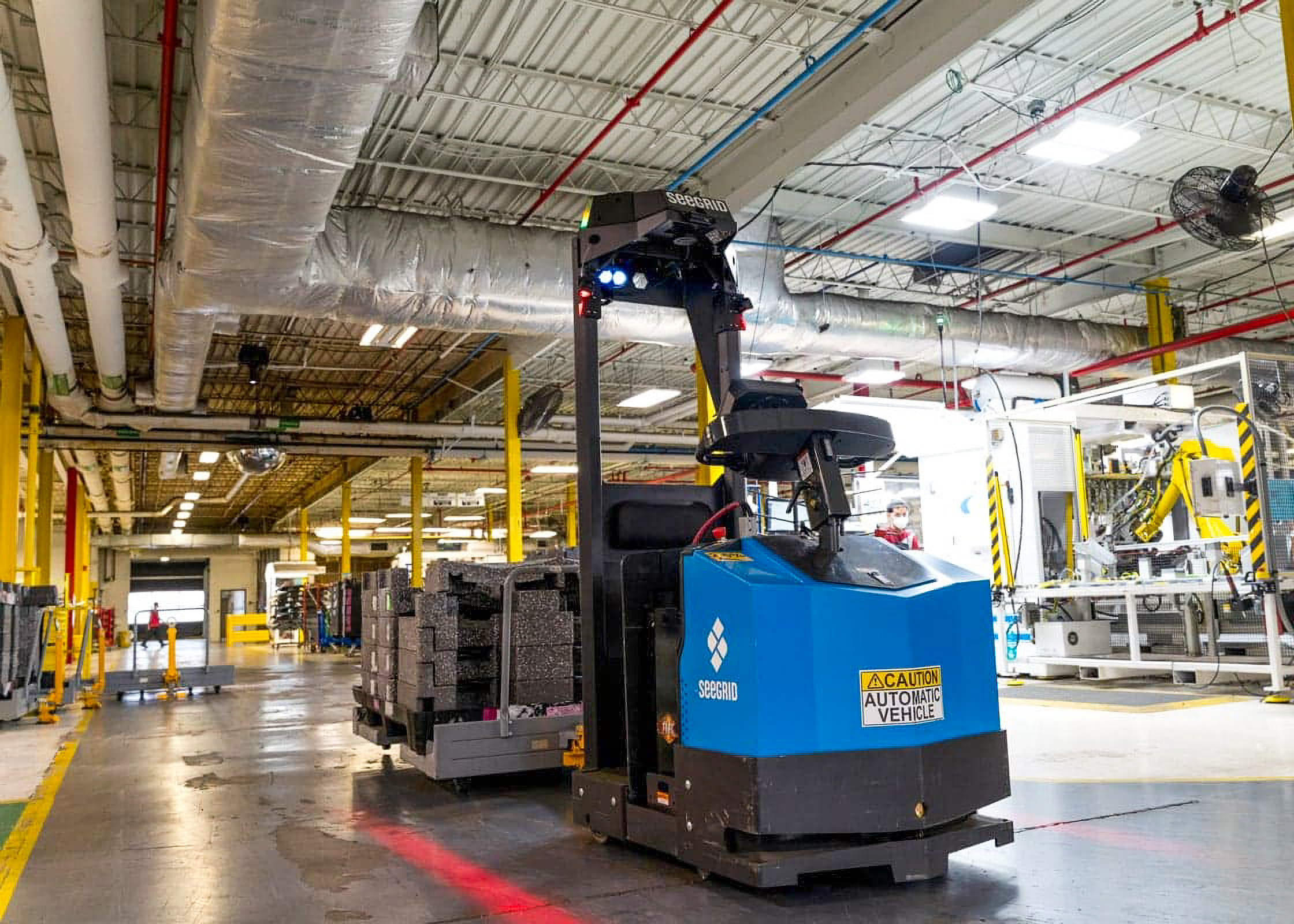 Autonomous forklift operating in modern factory