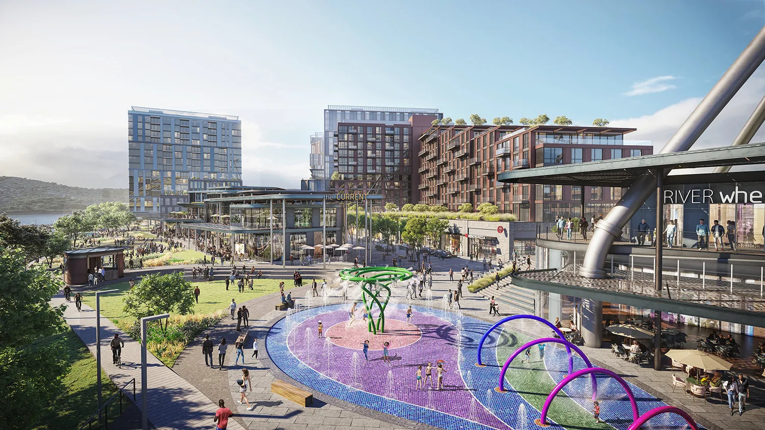 A rendering of a mixed-use riverside development during the day, featuring a large splash pad.