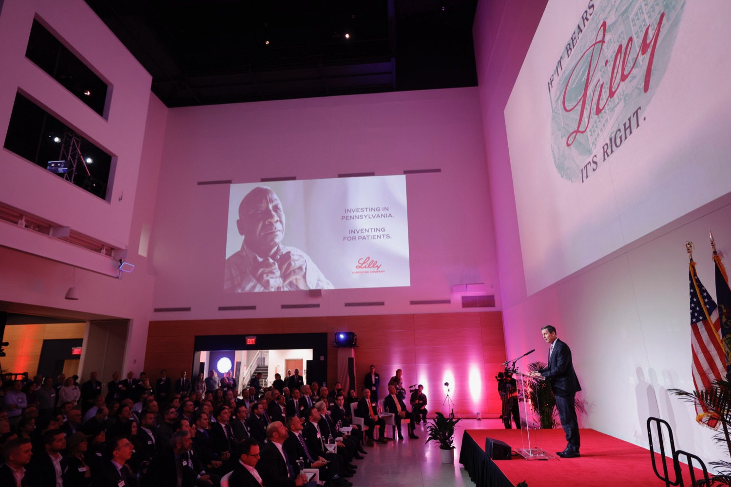 Corporate event with keynote speaker and projected visuals