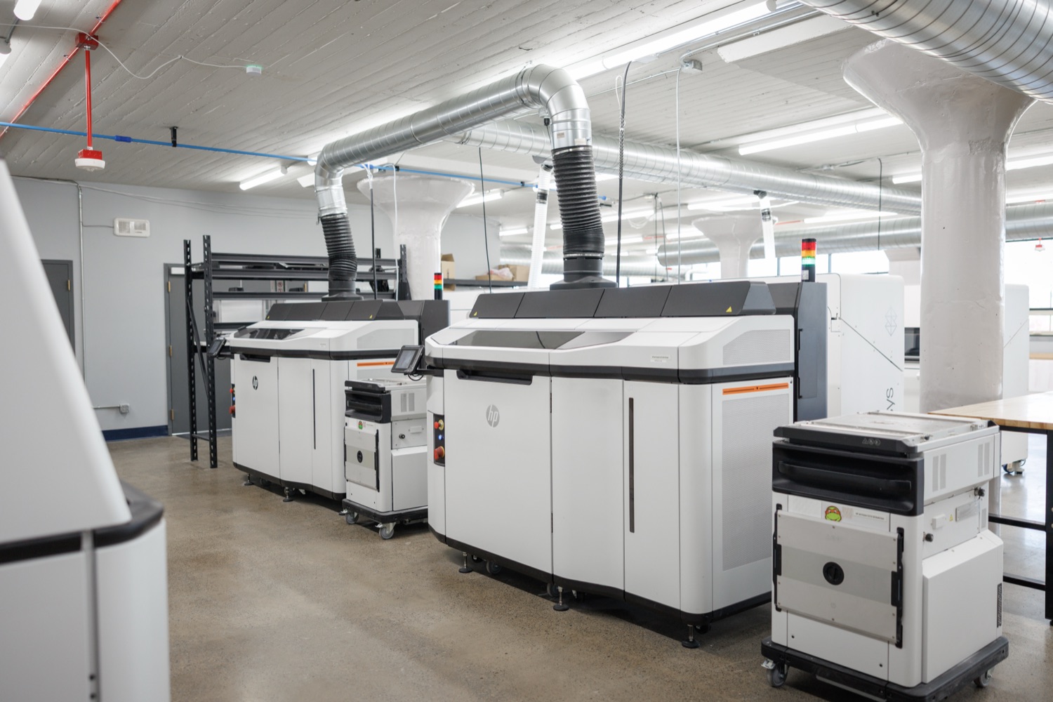 Large industrial laser cutters in a modern manufacturing environment,