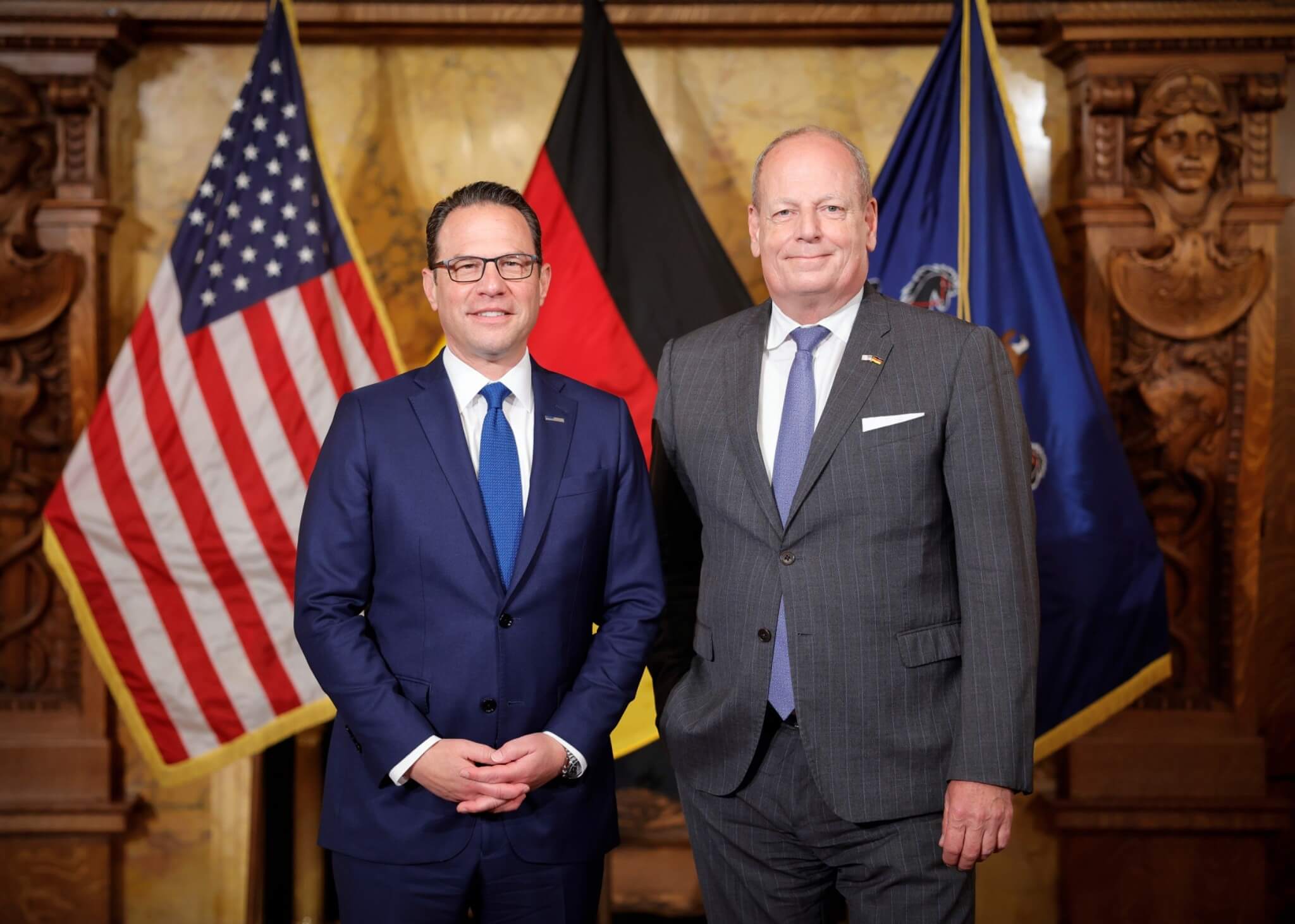 Governor Shapiro and German Ambassador Jens Hanefiled smle for a photo in the Pennsylvania Capitol