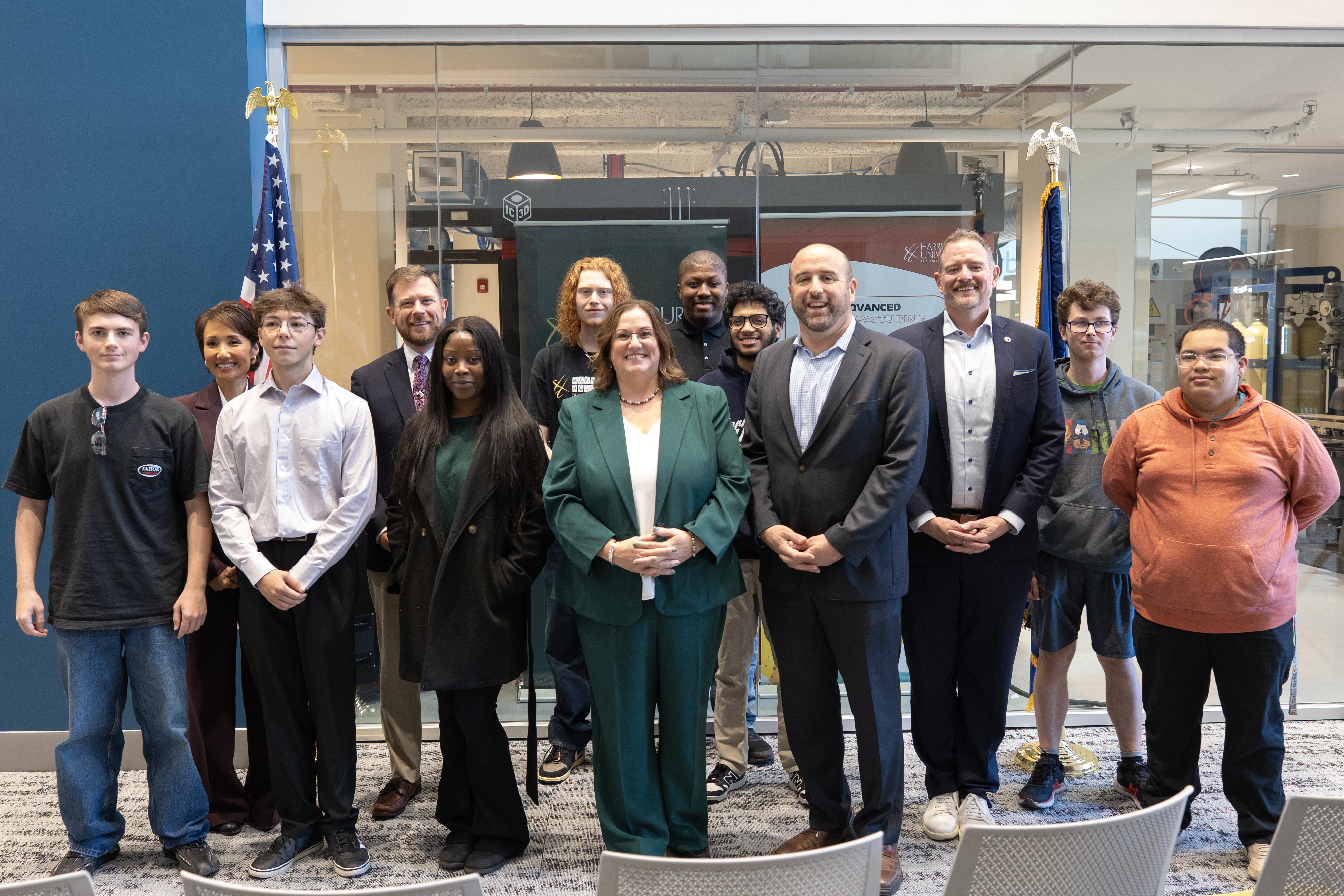 DCED Secretary Rick Siger poses fro a group photo with staff and students from Harrisburg University